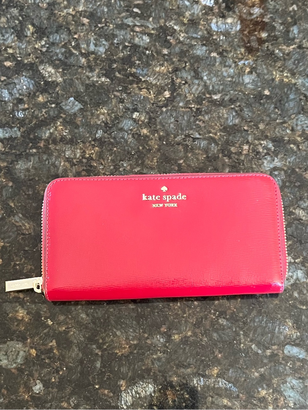 kate spade glossy Red Jam zip-around wallet with gold logo